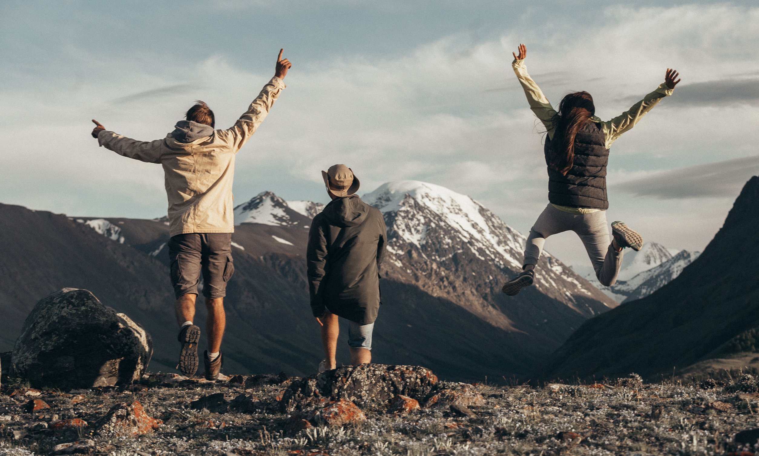 People Standing on Rocky Mountain